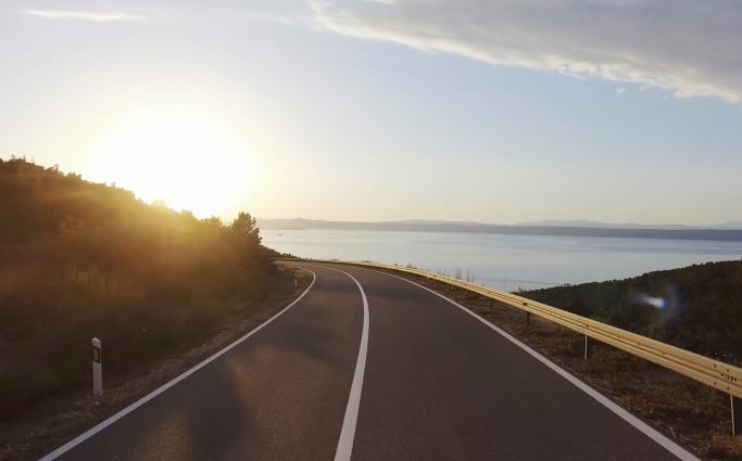 Sunset over road