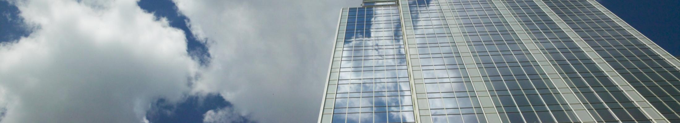 skyscraper with blue clouds