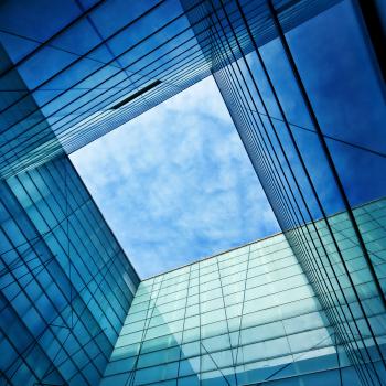 Blue sky through building