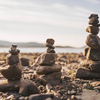 Tower of balancing rocks on beach